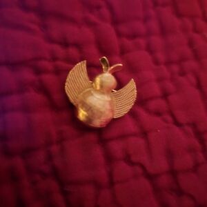 Trifari Gold Tone Bird Brooch on Red Background